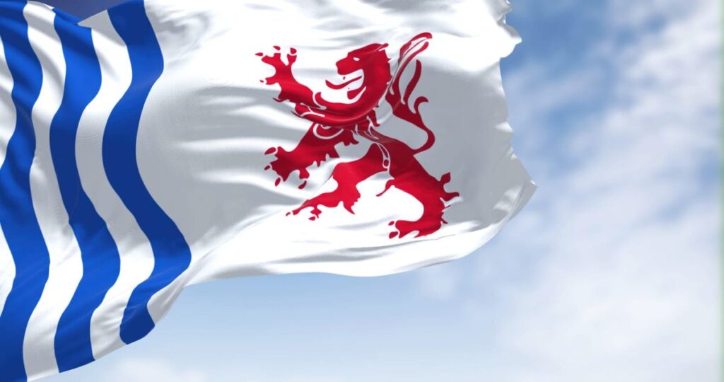 The flag of Nouvelle-Aquitaine is waving in the wind