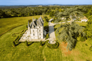 The full estate aerial shows a secluded, spacious chateau living retreat. Château de Lasfonds.