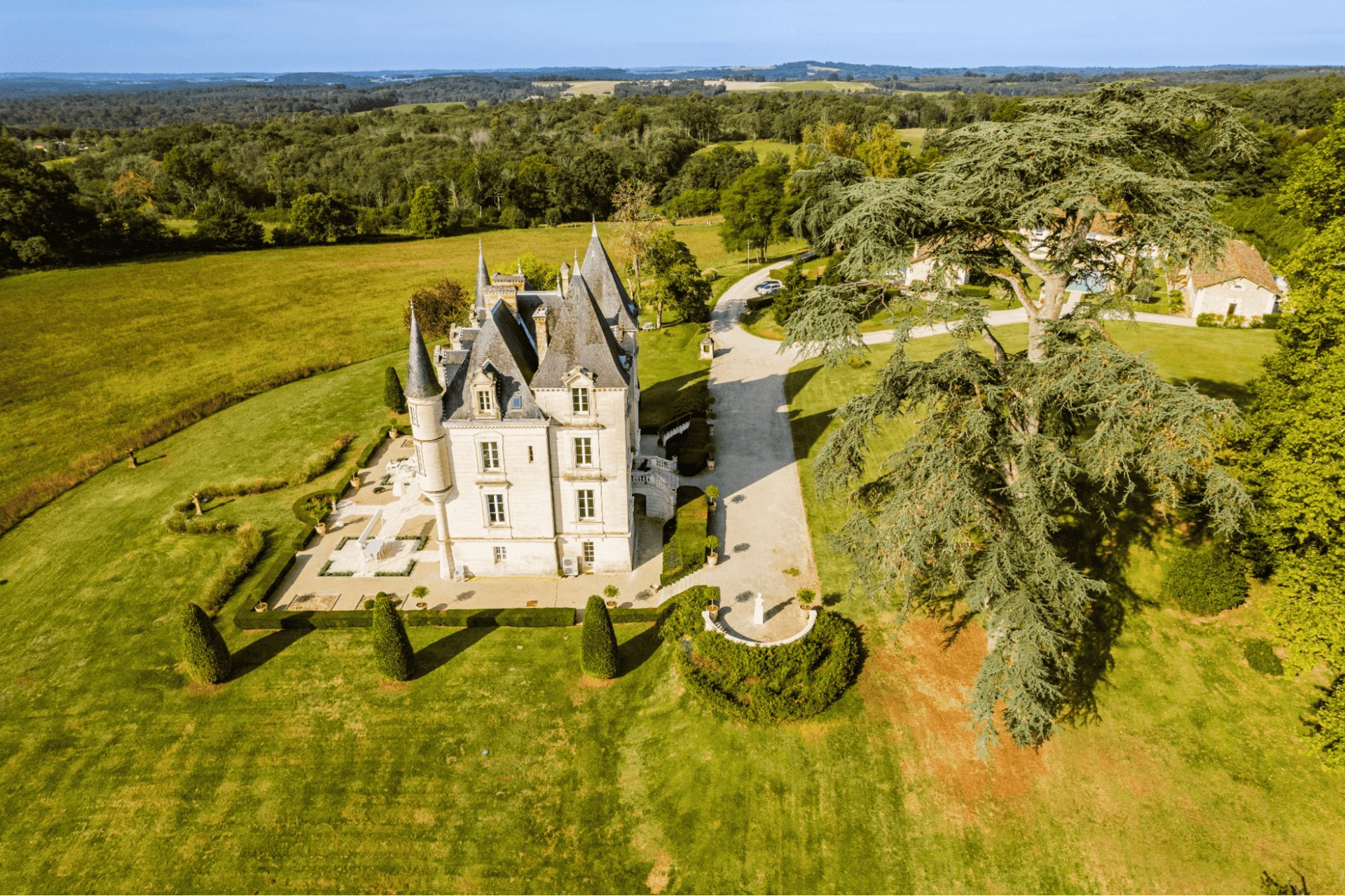 The full estate aerial shows a secluded, spacious chateau living retreat. Château de Lasfonds.