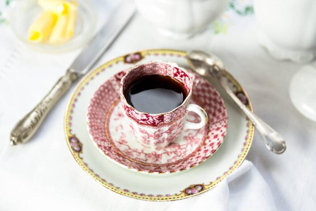 Antique porcelain breakfast setting with coffee