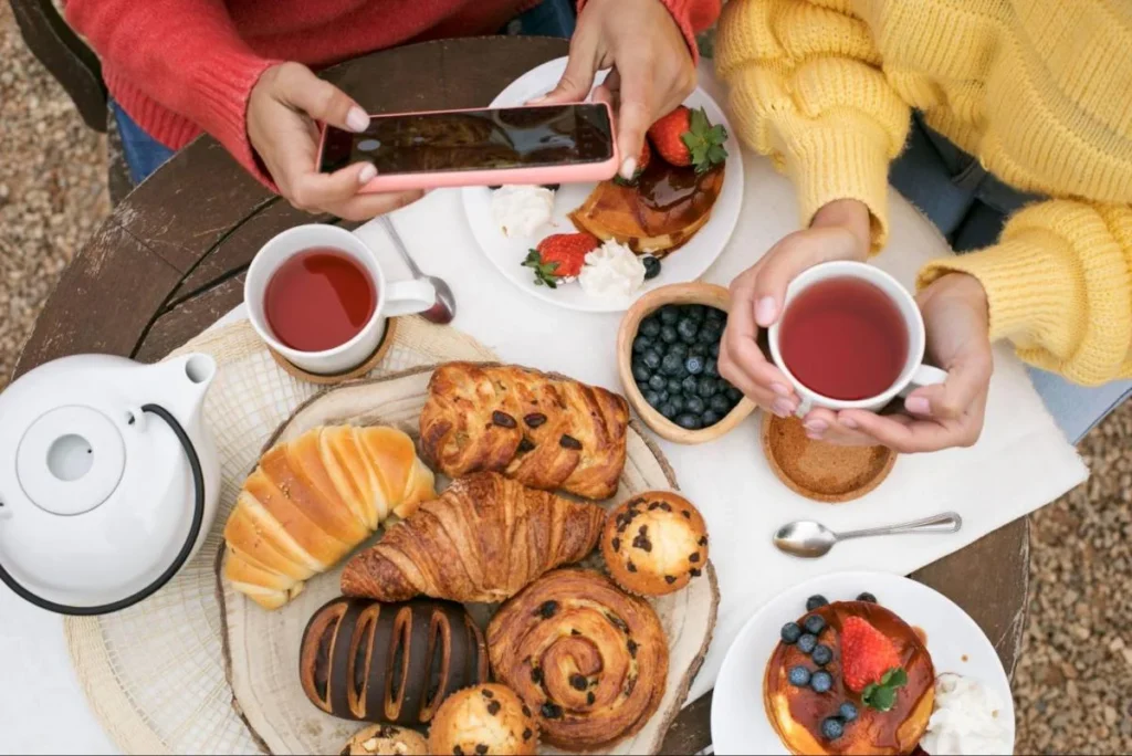 Breakfast pastries and tea enjoyed outdoors during a French countryside bucket list trip
