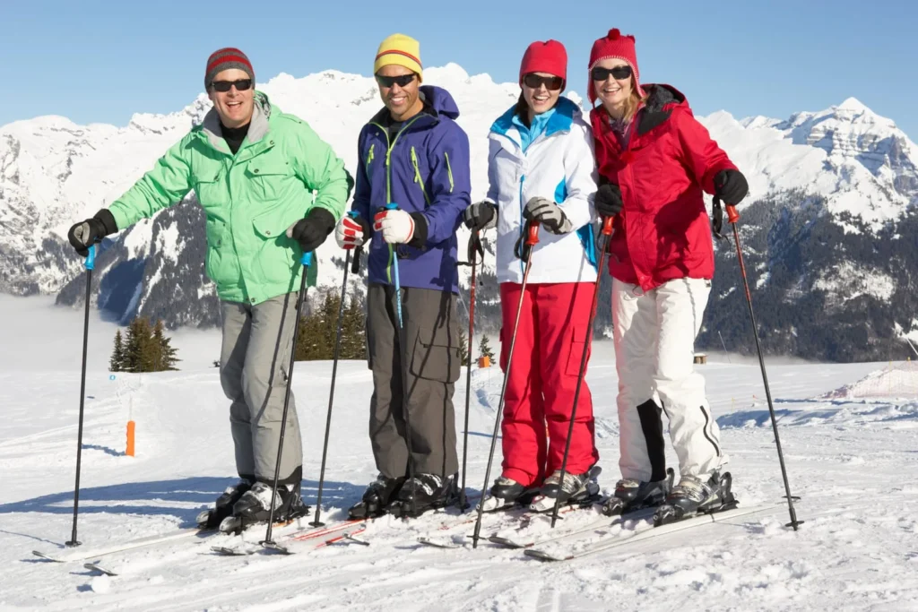 Couples skiing in the French Alps, showcasing an adventurous honeymoon in France during winter