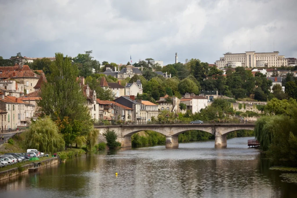 Picturesque Périgord town with stone bridge over river in southwest France