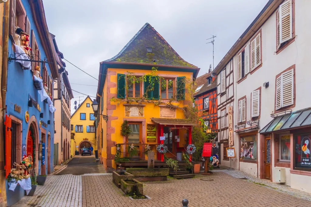 Colorful half-timbered houses in French village street with traditional architecture