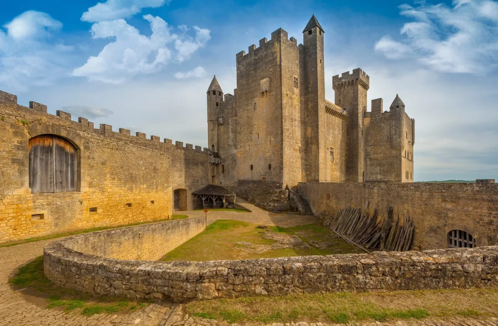 Medieval Château de Beynac fortress with stone walls and towers overlooking the Dordogne Valley
