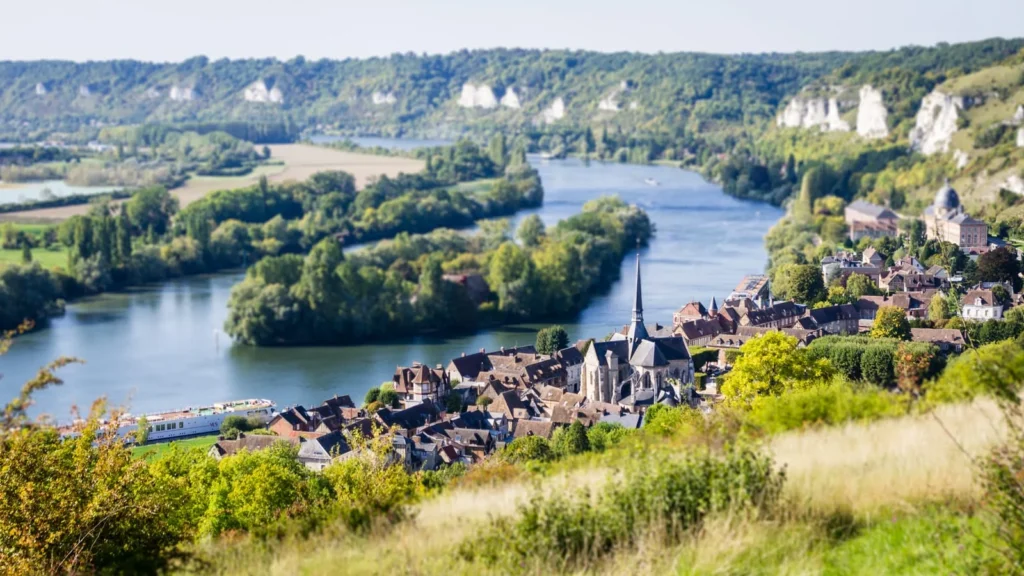 River valley landscape with village and church in Normandy region
