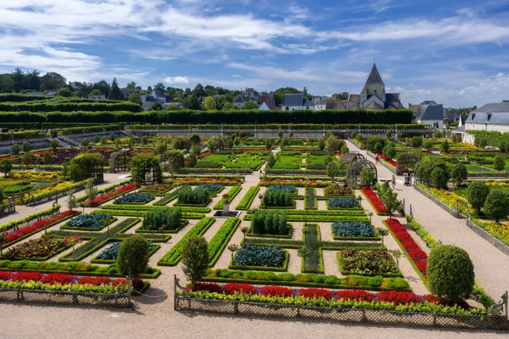 Formal French château gardens with geometric landscaping and flowers