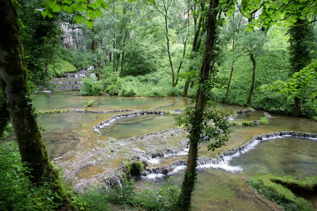 Scenic waterfalls and lush greenery in Baume-les-Messieurs, Jura region, France