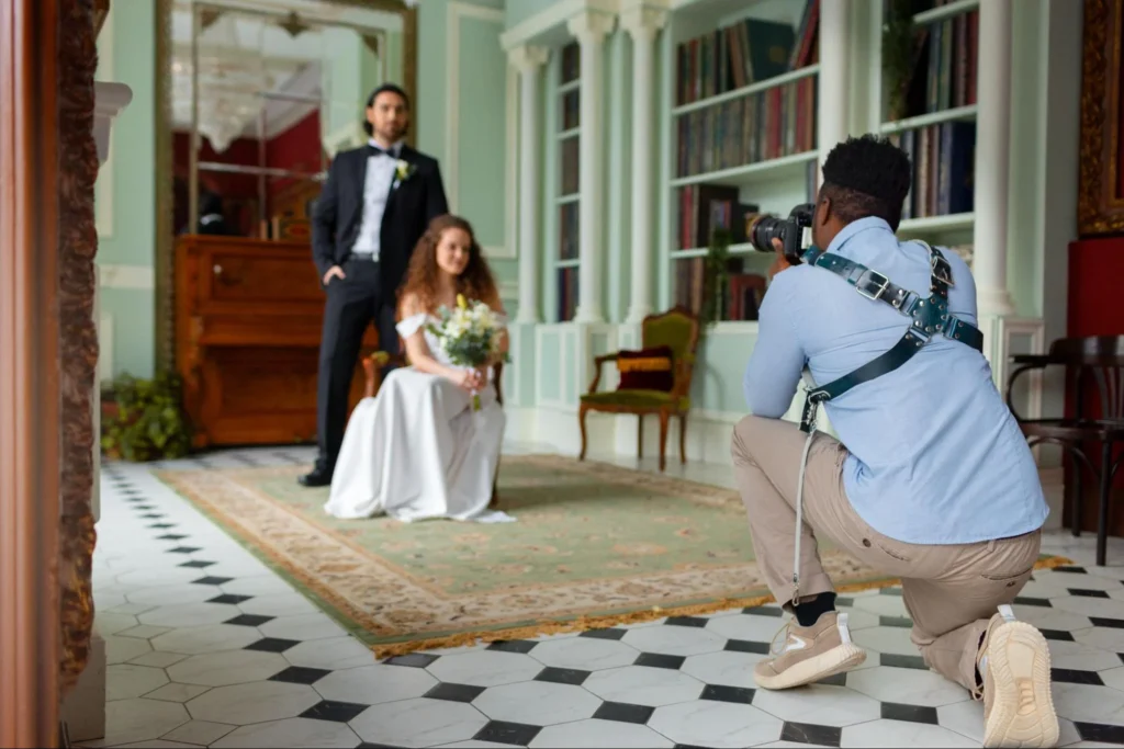 Bride and groom photoshoot inside chateau with photographer capturing moments