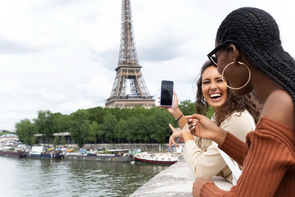 Tourists visiting the Eiffel Tower in Paris during a France sightseeing trip