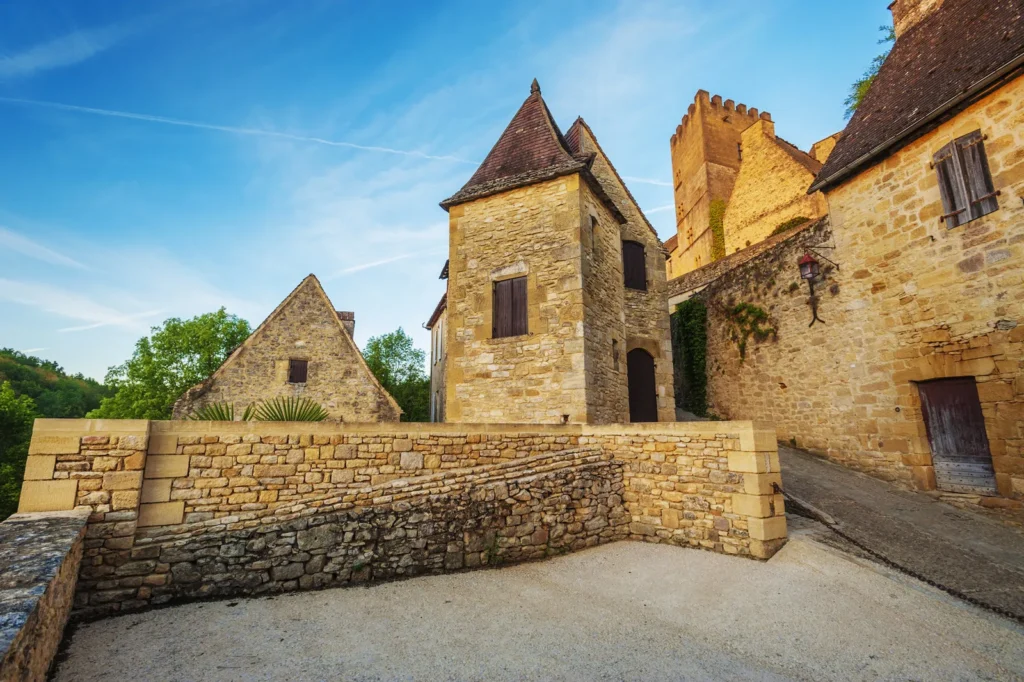 Traditional stone houses and castle buildings in a medieval French village.