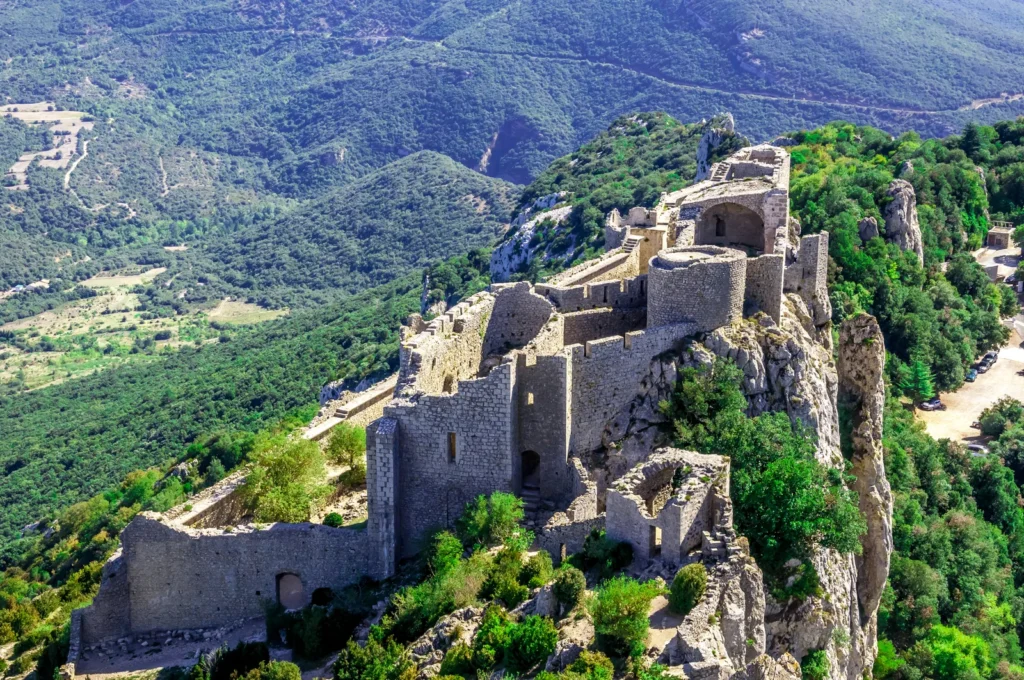 Ruined Cathar fortress perched on a mountain ridge in southern France.
