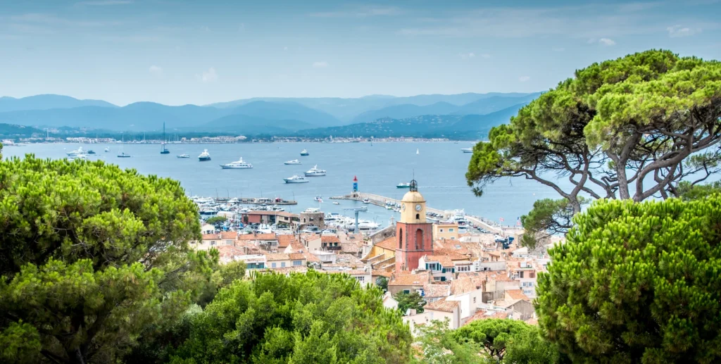 Scenic French coastal town with boats and sea views