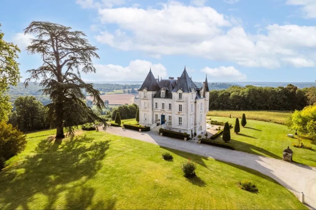 Chateau surrounded by gardens and countryside views