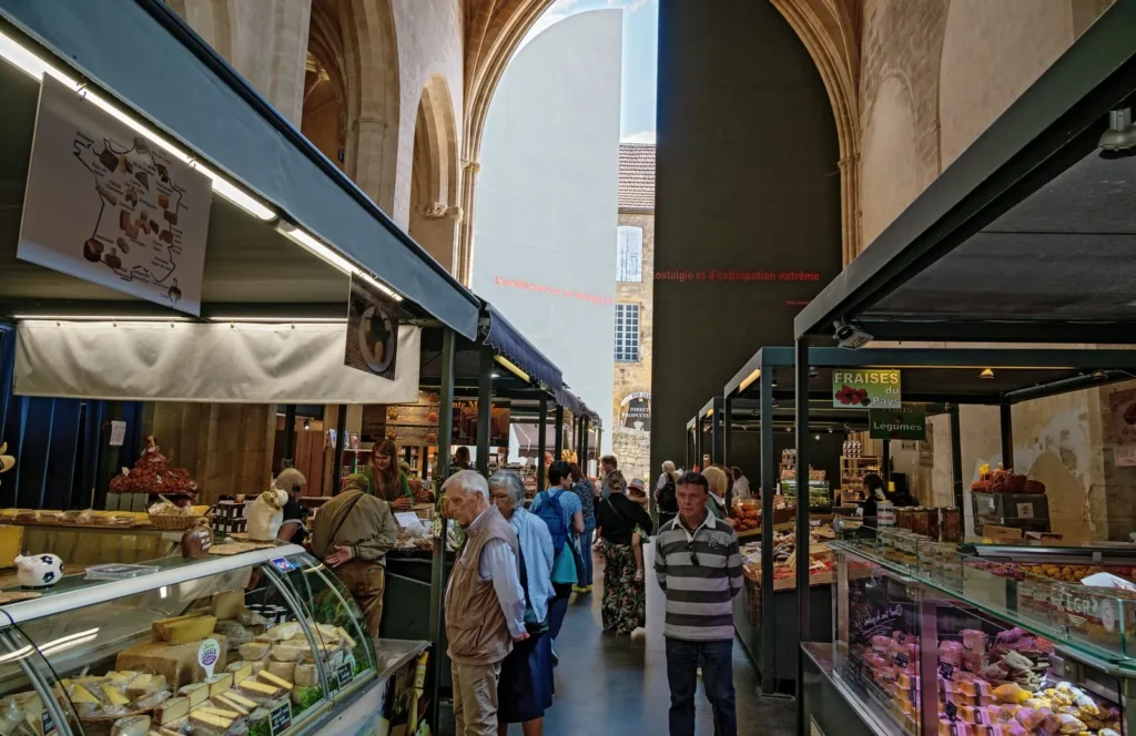 Historic indoor market with colorful stalls and traditional architecture.