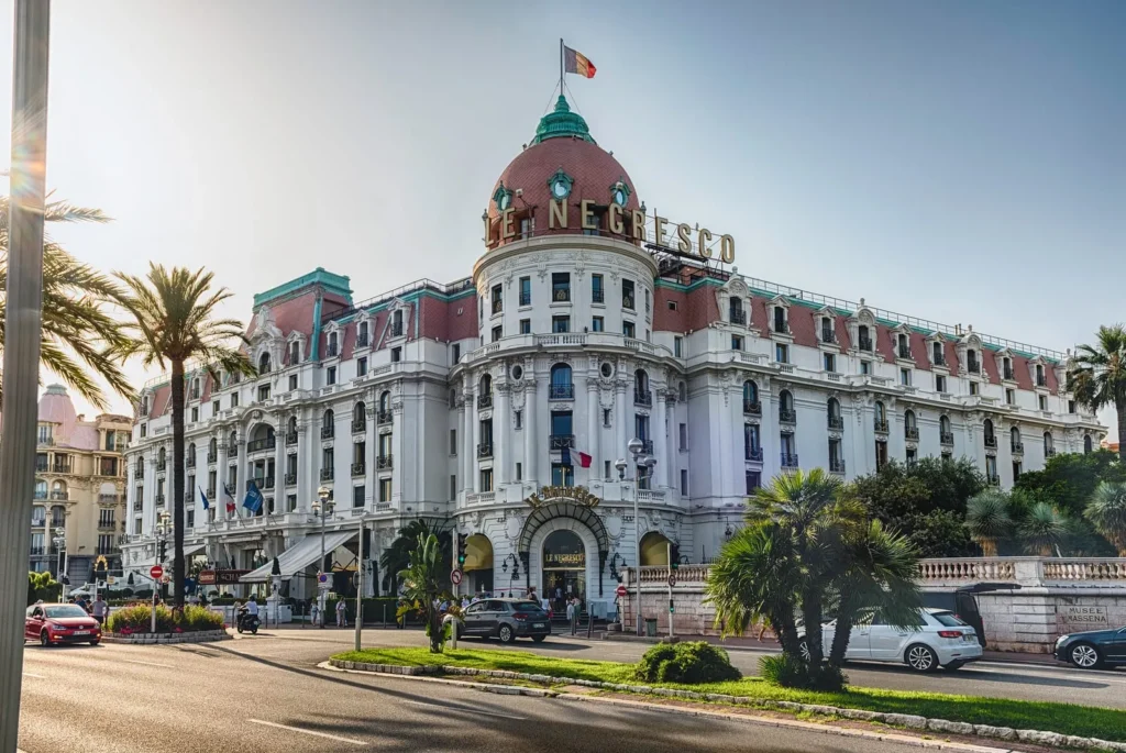 Iconic Le Negresco luxury hotel on the Promenade des Anglais in Nice, featuring its famous pink dome and elegant architecture