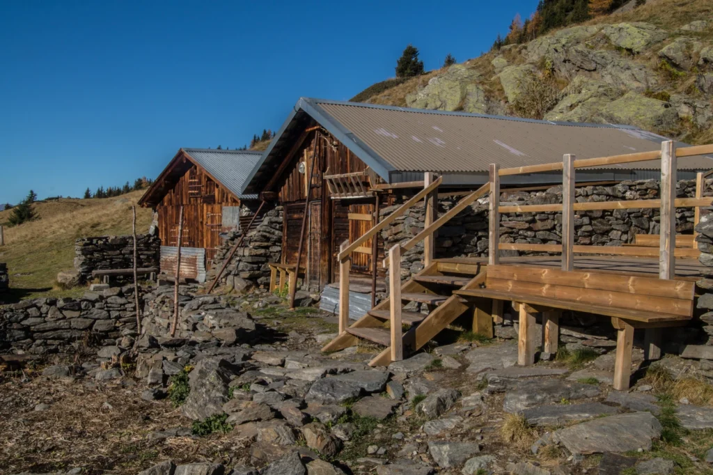 Rustic mountain chalets surrounded by rocky slopes