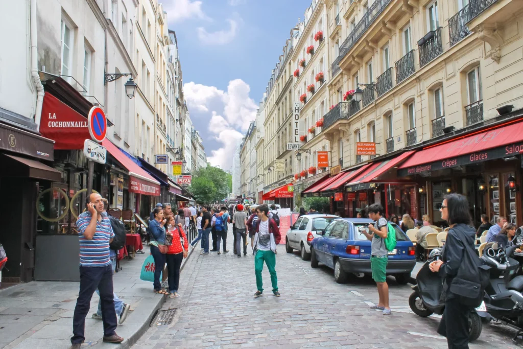 Busy restaurant street in Paris