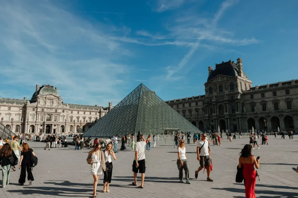 Louvre Museum courtyard with glass pyramid