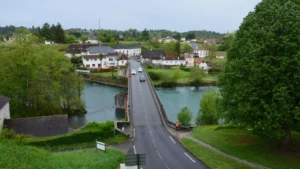 Village bridge crossing a calm river in rural France