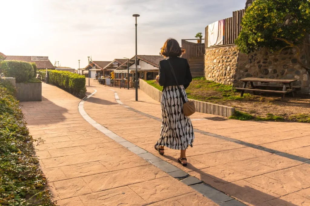 Woman walking through a French village