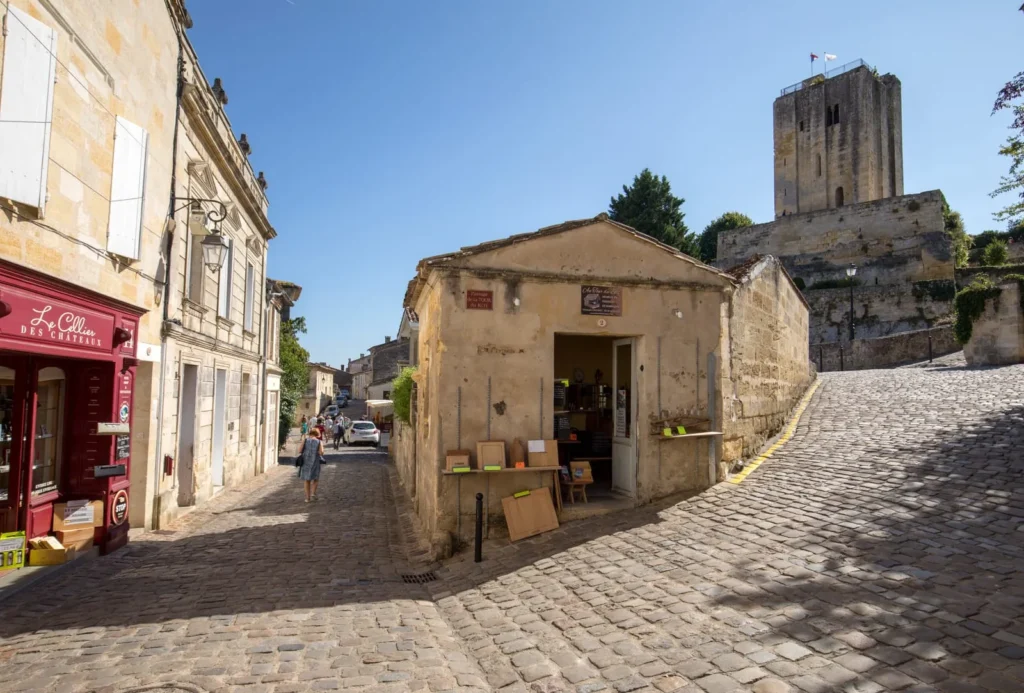 Cobblestone street near stone tower