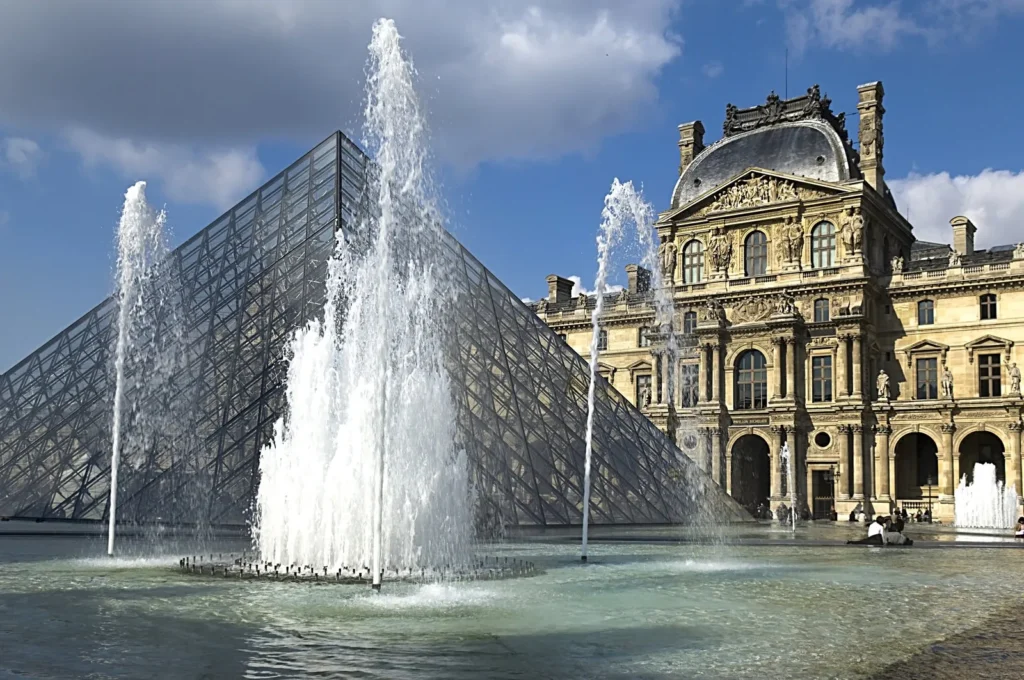 Louvre Pyramid and fountains in Paris