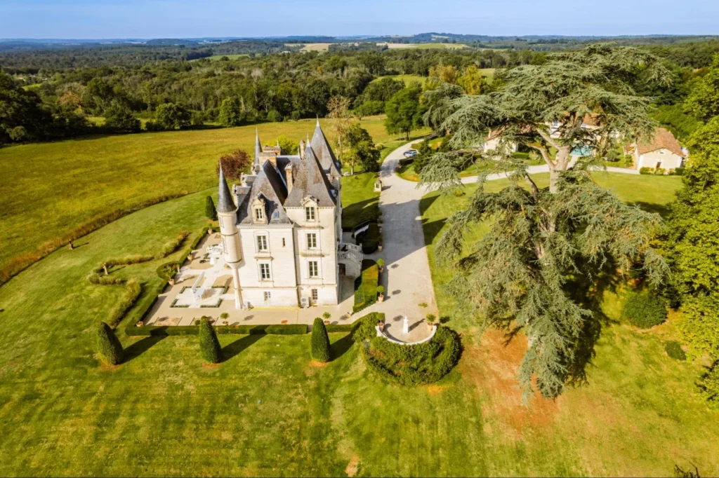 Restored French chateau surrounded by gardens and countryside