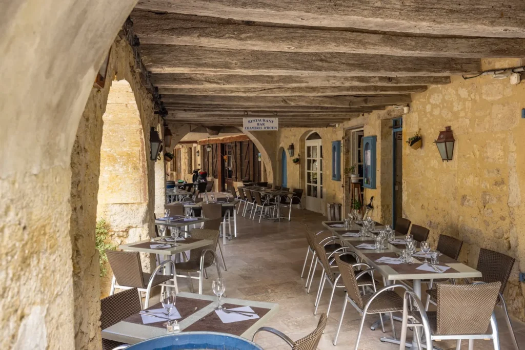 Outdoor restaurant in a stone arcade