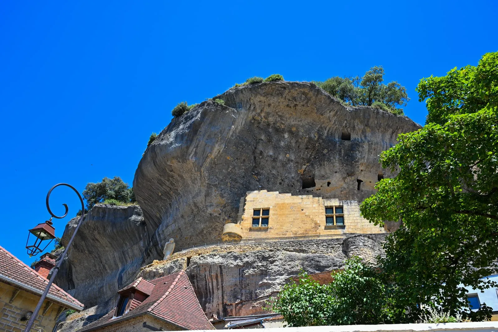 Historic cliffside homes built into limestone rock