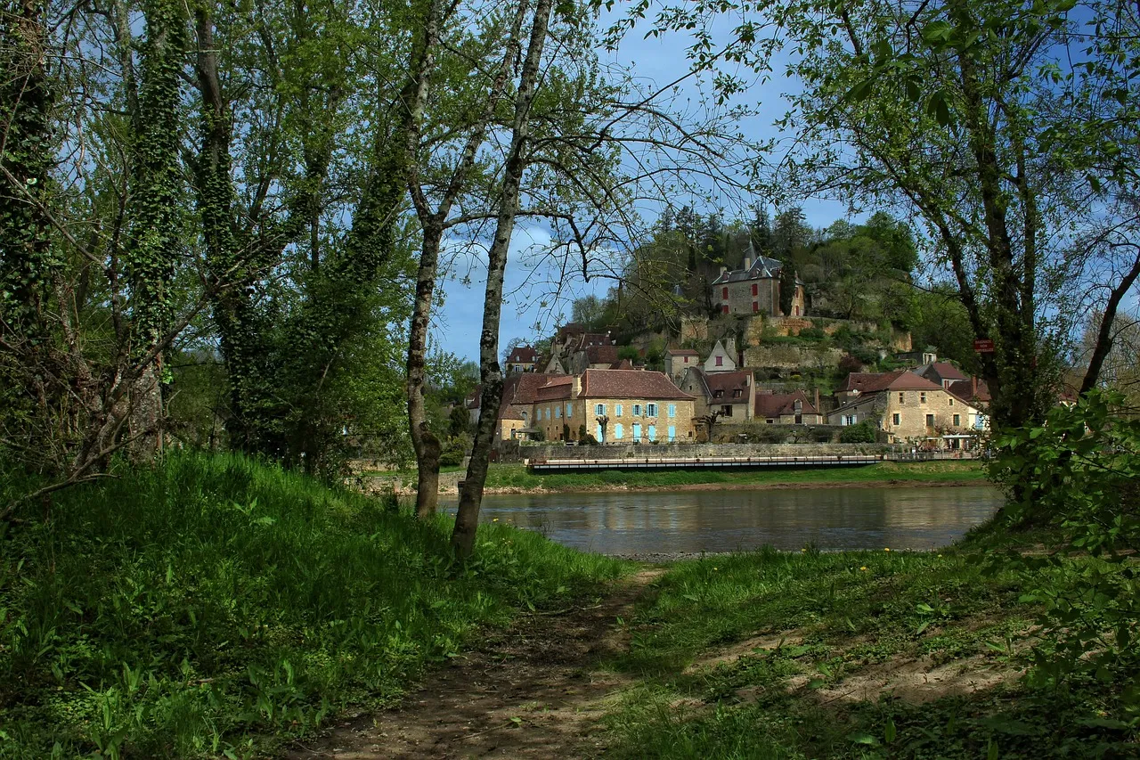 Riverside village houses and historic buildings along the Dordogne River