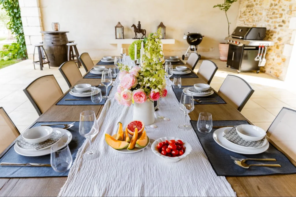 Outdoor dining table set for a group meal at a French château