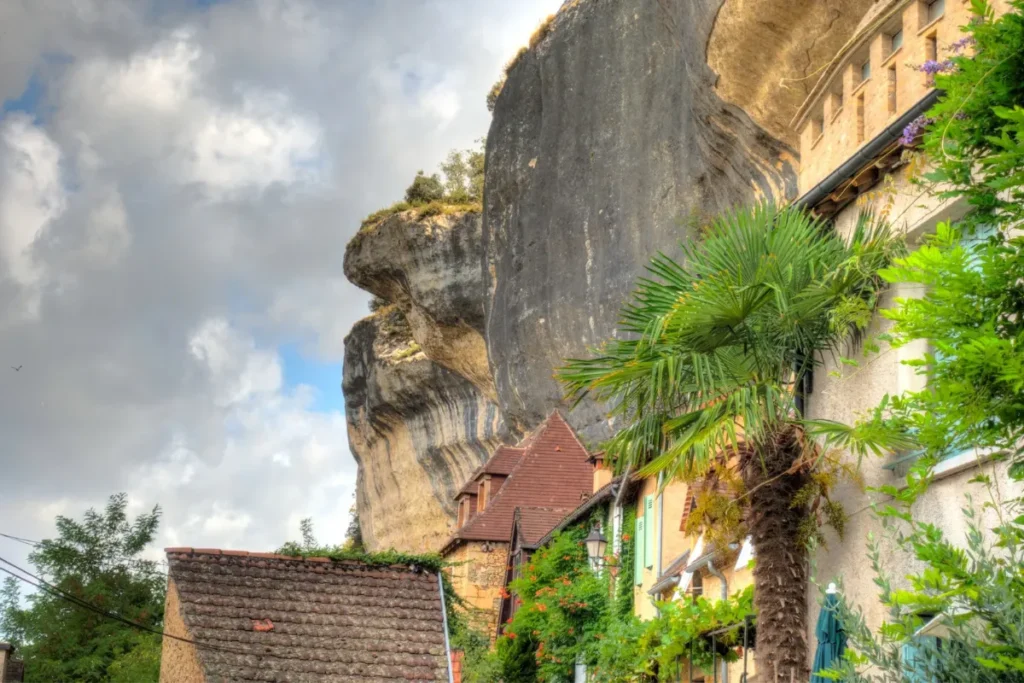 Limestone cliffs and village homes in Les Eyzies